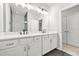 Bathroom featuring a dual sink vanity, mirror, and shower at 772 Aerial Se Way, Atlanta, GA 30312
