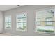 Bright bedroom featuring three large windows providing ample natural light and street views at 772 Aerial Se Way, Atlanta, GA 30312