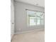 Bright bedroom with carpet flooring, window and base molding at 772 Aerial Se Way, Atlanta, GA 30312