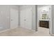 Cozy bedroom with carpeted floors, double closets and a view into the en-suite bathroom at 772 Aerial Se Way, Atlanta, GA 30312
