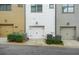 Exterior of townhomes with individual garages and well-maintained landscaping at 772 Aerial Se Way, Atlanta, GA 30312
