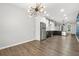 Open-concept kitchen features stainless steel appliances, and an adjacent dining area at 772 Aerial Se Way, Atlanta, GA 30312