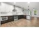 Modern kitchen with stainless steel appliances, white subway tile, and dark wood cabinets at 772 Aerial Se Way, Atlanta, GA 30312