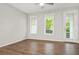 Bright living room with hardwood floors, a ceiling fan and natural light at 772 Aerial Se Way, Atlanta, GA 30312