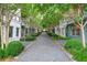 Scenic view of the townhouse lined street with mature trees and manicured landscaping at 772 Aerial Se Way, Atlanta, GA 30312