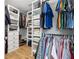 Walk in closet features built in storage and shelving at 908 Lance Cir, Lawrenceville, GA 30043