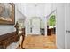 Inviting foyer features hardwood floors, high ceilings, and an arched doorway with views of the study at 908 Lance Cir, Lawrenceville, GA 30043