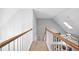 Upstairs hallway with railing and overhead natural light at 908 Lance Cir, Lawrenceville, GA 30043