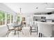 Bright, eat-in kitchen with breakfast bar, stainless appliances, and large windows at 908 Lance Cir, Lawrenceville, GA 30043