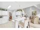 Bright and airy kitchen with white cabinetry, a breakfast bar, and seamless access to the living room at 908 Lance Cir, Lawrenceville, GA 30043