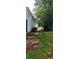 Backyard with grass, trees, and a lake in the distance at 95 Willow Tree Ter, Covington, GA 30016