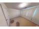 Bedroom with white walls, carpet, and a closet with vertical blinds at 95 Willow Tree Ter, Covington, GA 30016