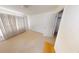 Bedroom with white walls, carpet, and a door leading to another room at 95 Willow Tree Ter, Covington, GA 30016
