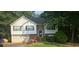 Charming two-story home features a brick facade, attached garage, and a well-maintained front yard at 95 Willow Tree Ter, Covington, GA 30016