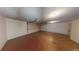 Empty garage with stained concrete flooring and an automatic door at 95 Willow Tree Ter, Covington, GA 30016