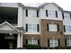 Exterior view of a two-story apartment building with black shutters and a brick facade at 10103 Waldrop Pl, Decatur, GA 30034