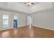 Large bedroom with hard wood flooring and multiple exits at 4000 Brittan Glade Trl, Snellville, GA 30039