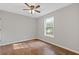 Bedroom features hardwood floors, natural light, and ceiling fan at 4000 Brittan Glade Trl, Snellville, GA 30039
