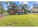 Charming home exterior featuring a lush front lawn and inviting curb appeal, creating a welcoming first impression at 4000 Brittan Glade Trl, Snellville, GA 30039
