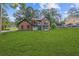 Charming brick two-story home boasts a manicured lawn and a bright blue front door at 4000 Brittan Glade Trl, Snellville, GA 30039