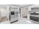Kitchen with stainless steel appliances, mosaic backsplash, and white cabinets at 4000 Brittan Glade Trl, Snellville, GA 30039