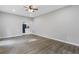 Open floorplan living room featuring hardwood floors and leads into the kitchen at 4000 Brittan Glade Trl, Snellville, GA 30039