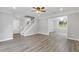 Open floor plan with newly installed hardwood floors and white trim throughout at 4000 Brittan Glade Trl, Snellville, GA 30039