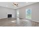 Spacious living room with fireplace, hardwood floors, and ample natural light at 4000 Brittan Glade Trl, Snellville, GA 30039