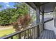 Covered porch overlooking a well-manicured lawn and mature trees at 4000 Brittan Glade Trl, Snellville, GA 30039