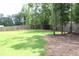 Large backyard featuring a lush green lawn and perimeter fencing at 688 Harmony Rd, Temple, GA 30179