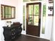 Elegant entryway featuring a wood door with sidelights and a stylish foyer table at 688 Harmony Rd, Temple, GA 30179