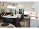 Bright kitchen features a large island with seating, stainless steel appliances, and stylish pendant lighting at 688 Harmony Rd, Temple, GA 30179