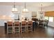 Bright kitchen featuring a kitchen island with white countertop, cabinets and an adjacent dining area at 688 Harmony Rd, Temple, GA 30179