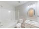 Clean bathroom featuring a shower and tub combo, single sink vanity, and an oval mirror at 125 Ashbury Ct, Dallas, GA 30157