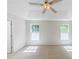 Bright bedroom with two large windows that let in natural light to highlight the neutral walls and carpet at 125 Ashbury Ct, Dallas, GA 30157