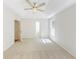 Spacious bedroom features plush carpet, tray ceiling, and a ceiling fan at 125 Ashbury Ct, Dallas, GA 30157