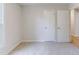 Bedroom featuring neutral carpet and freshly painted walls, with easy access to other rooms at 125 Ashbury Ct, Dallas, GA 30157