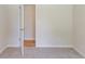 Bedroom featuring freshly painted walls, neutral carpet, and access to a bright closet at 125 Ashbury Ct, Dallas, GA 30157