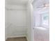 Spacious walk-in closet with wire shelving and views into the main bedroom at 125 Ashbury Ct, Dallas, GA 30157