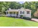 Charming single Gathering home featuring a well-manicured lawn and cozy front porch at 125 Ashbury Ct, Dallas, GA 30157