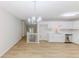 Open-concept kitchen with stainless steel appliances and new luxury vinyl plank flooring at 125 Ashbury Ct, Dallas, GA 30157