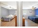 Dual bedroom space shows hardwood floors, ceiling fans and calming gray walls at 1919 Cheatham Woods Sw Dr, Marietta, GA 30008