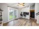 Open dining area with bar seating, hardwood floors, and sliding glass doors to the backyard at 1919 Cheatham Woods Sw Dr, Marietta, GA 30008