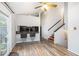 Dining room with new floor, ceiling fan, and stairs leading to the second level at 1919 Cheatham Woods Sw Dr, Marietta, GA 30008
