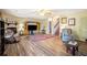 Open living room featuring hardwood floors, cozy furniture, and a decorative fireplace at 1919 Cheatham Woods Sw Dr, Marietta, GA 30008