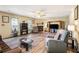 Spacious living room with wood floors, a ceiling fan, and a cozy fireplace at 1919 Cheatham Woods Sw Dr, Marietta, GA 30008