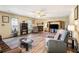 Spacious living room with hardwood floors, a fireplace, and abundant natural light at 1919 Cheatham Woods Sw Dr, Marietta, GA 30008