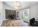 Versatile living space with hardwood floors, backyard access, and a ceiling fan at 1919 Cheatham Woods Sw Dr, Marietta, GA 30008