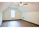 Attic room featuring hardwood floors, ceiling fan and window at 3050 Baymount Dr, Lawrenceville, GA 30043