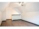 Attic room featuring hardwood floors, ceiling fan and window at 3050 Baymount Dr, Lawrenceville, GA 30043